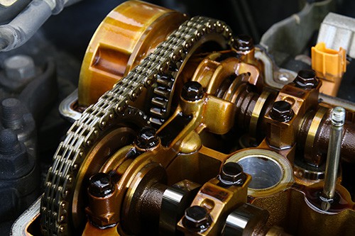 Closeup view of a camshaft with timing chain. Concept image of “Unraveling the Ford Timing Chain Rattle “ | Modern Auto Service in Fruitland, ID.